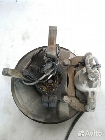 Кулак поворотный левый Mitsubishi Outlander XL 2.4