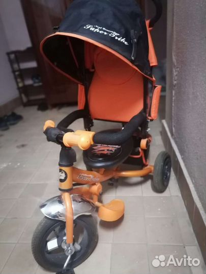 Трехколесный велосипед с ручкой