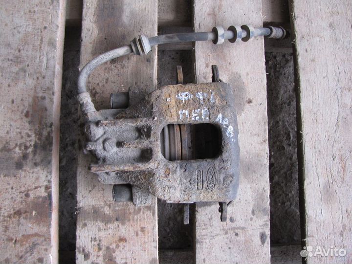 Суппорт пер. левый Ford Focus 1 рест