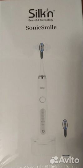 Электрическая зубная щетка