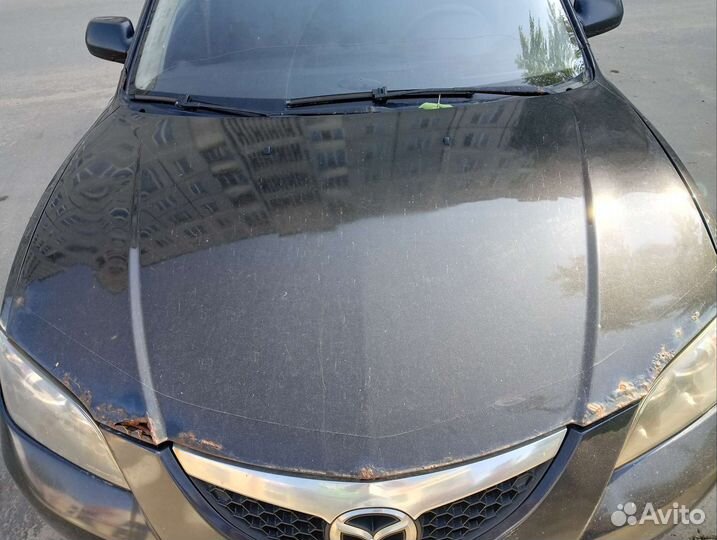 Капот на мазда32006 седан