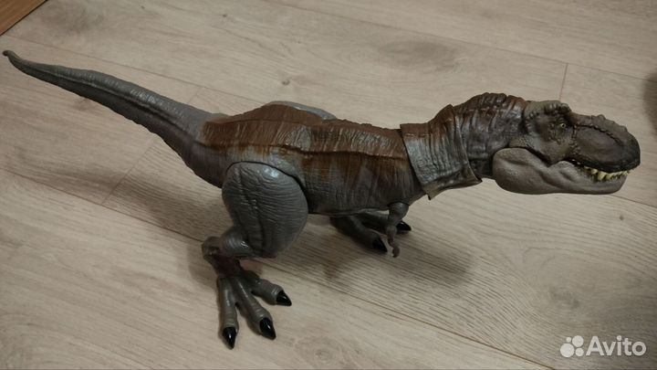 Детская игрушка - динозавр Рекс