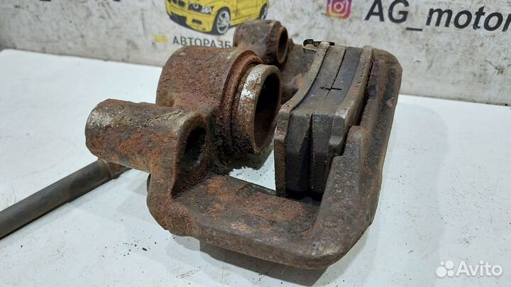 Суппорт тормозной передний левый Kia Rio 1