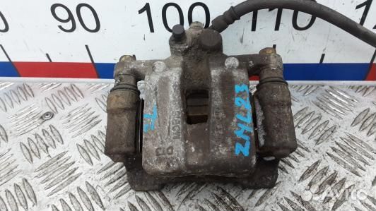 Суппорт тормозной задний левый KIA sportage 3 (ZML