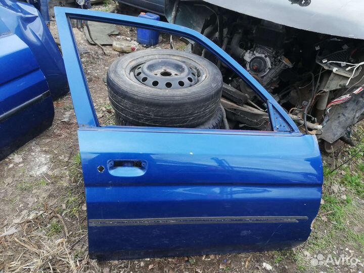 Дверь Мазда Демио 1