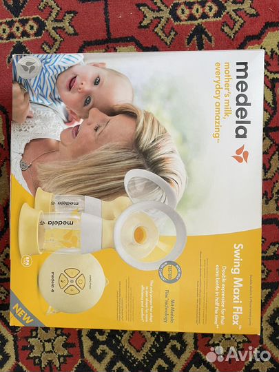 Молокоотсос Medela swing maxi flex