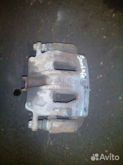 Суппорт передний левый правый Hyundai Santa FE