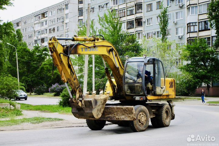 Услуги колесного экскаватора