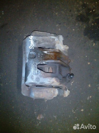 Суппорт передний левый правый Hyundai Santa FE