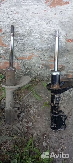 Стойка амортизатора передняя Киа Спектра