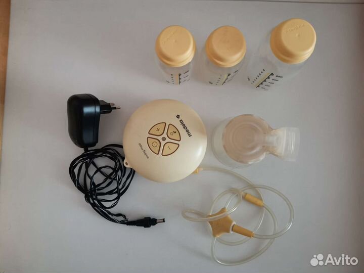 Молокоотсос medela электрический