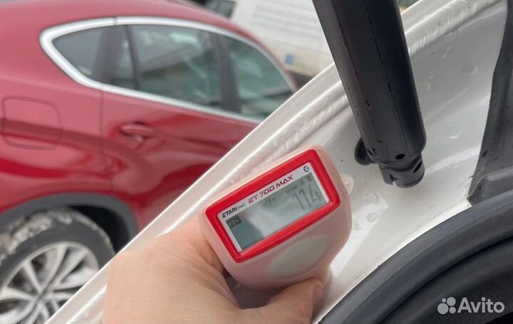 Проверка кузова Honda на стапеле, толщиномером