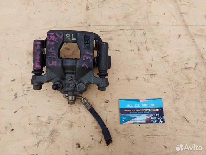 Суппорт тормозной задний левый Nissan Juke F15