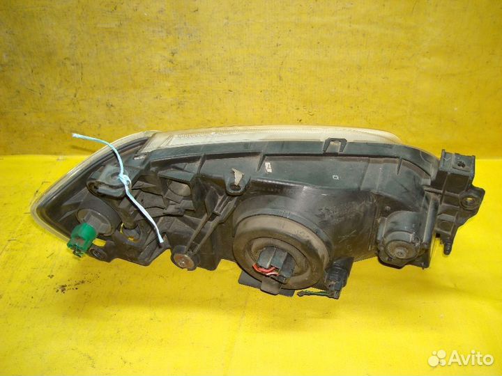 Фара левая Mazda Demio DW3W