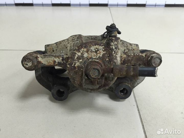 Суппорт передний правый Nissan Almera Classic B10