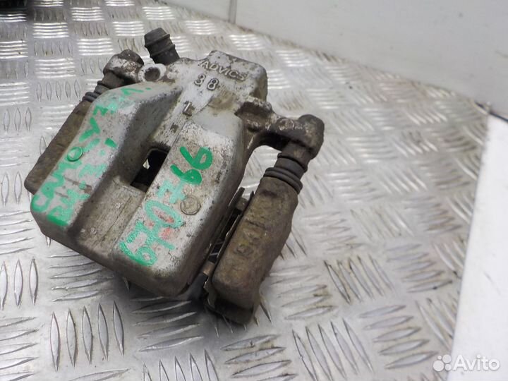 Суппорт тормозной задний левый Toyota Camry 2006-2