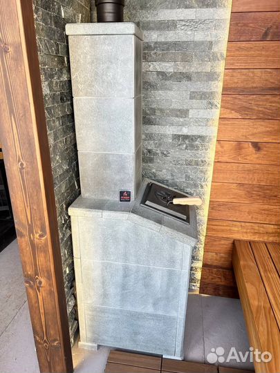 Чугунная печь для бани Гроза Технолит в камне