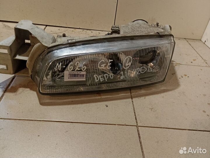 Фара левая mazda 626 ge