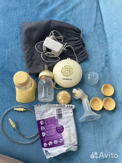 Молокоотсос medela swing