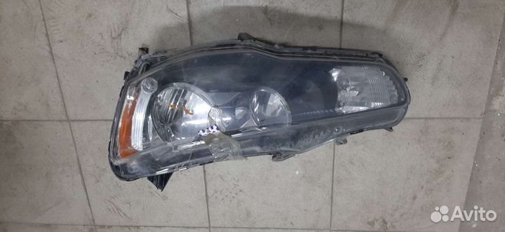 Фара Л. Mitsubishi Lancer X/2009