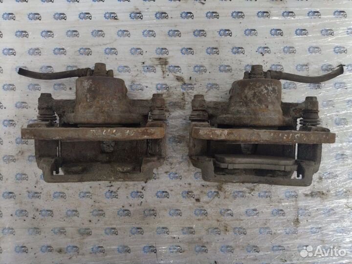 Суппорт передний Mazda 323 Bj