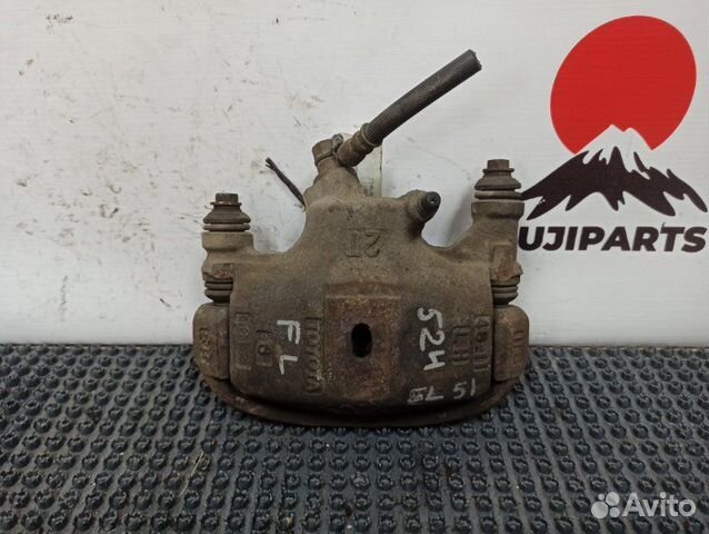 Суппорт тормозной задний левый Toyota Corsa EL51