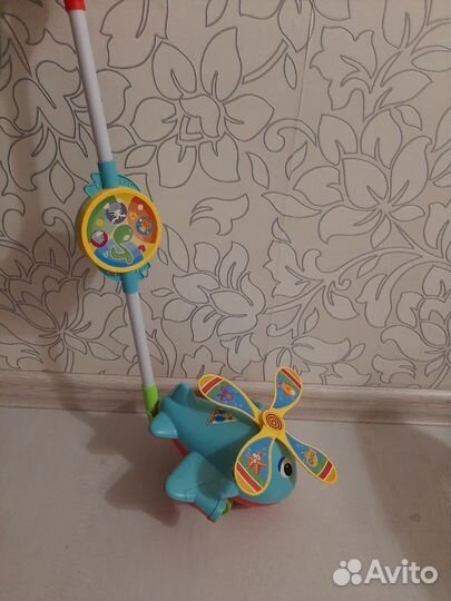 Игрушка каталка с ручкой