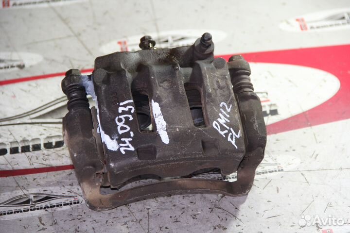 Суппорт перед лево c Nissan Liberty RM12 QR20DE