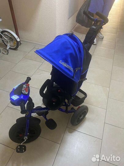 Трехколесный велосипед с ручкой