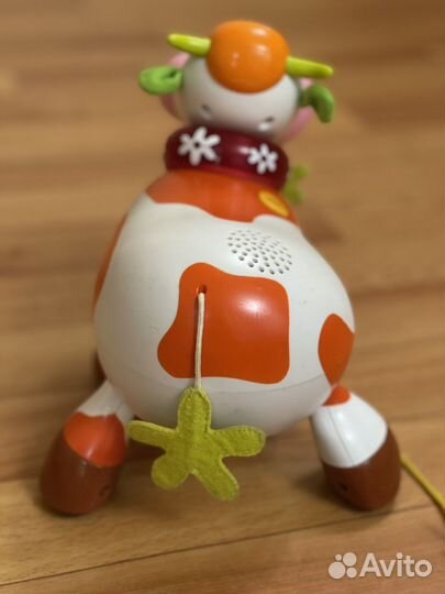 Игрушка Корова музыкальная на колесах