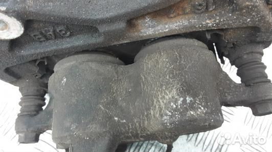 Суппорт тормозной передний левый mitsubishi L200 K