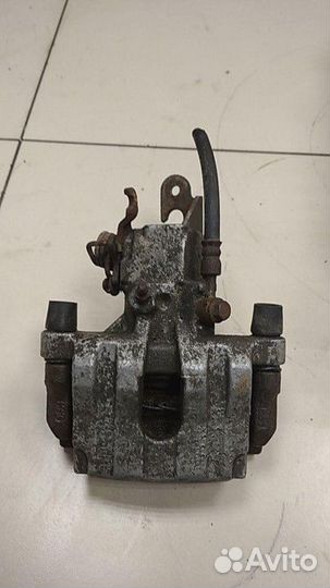 Суппорт задний левый Nissan Primera