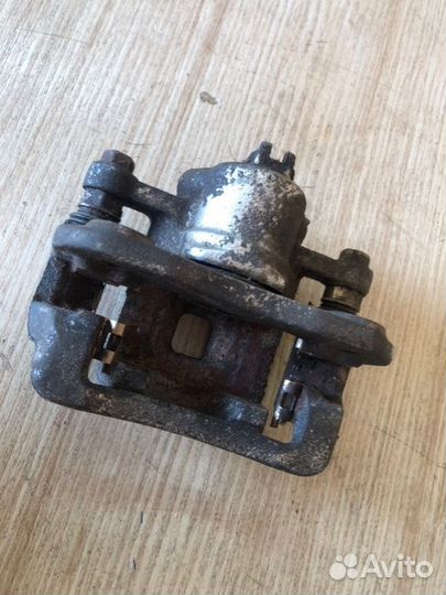 Суппорт тормозной задний левый Ssangyong Actyon