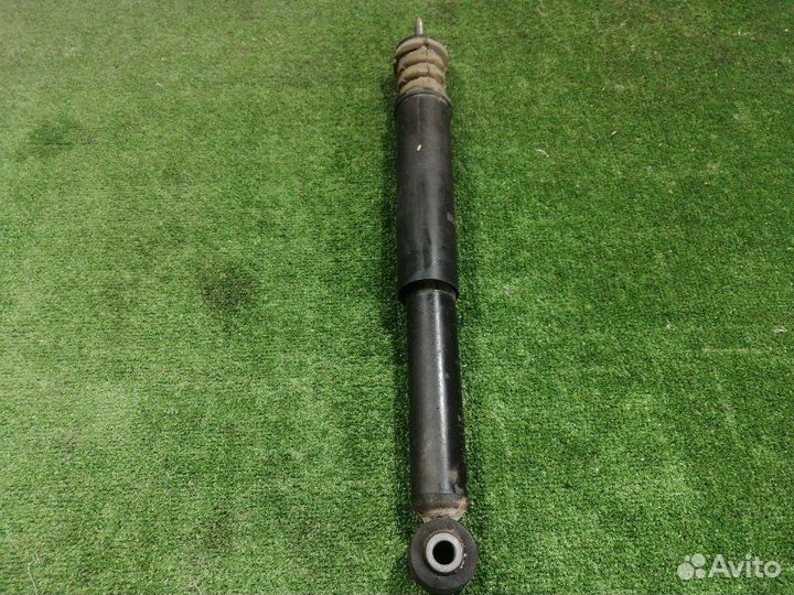 Амортизатор задний левый Nissan Micra K12E CR12DE