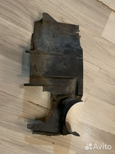 Нижний Кожух фар e34