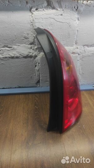 Фонарь заднего хода задний правый Nissan Primera P