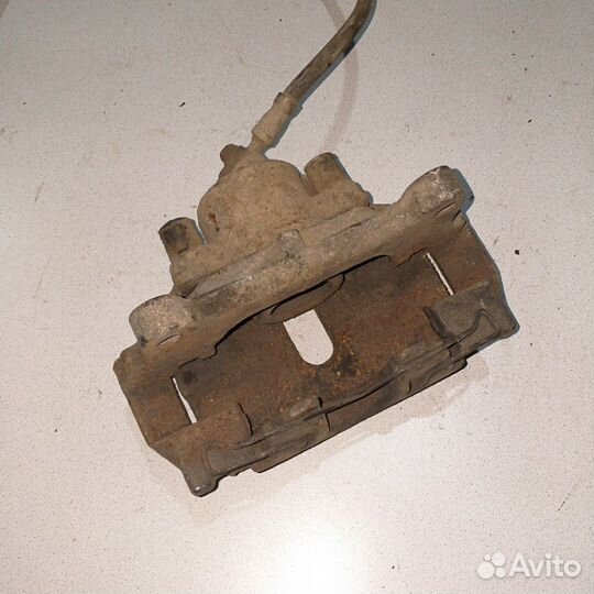 Суппорт тормозной передний Volkswagen Passat B7