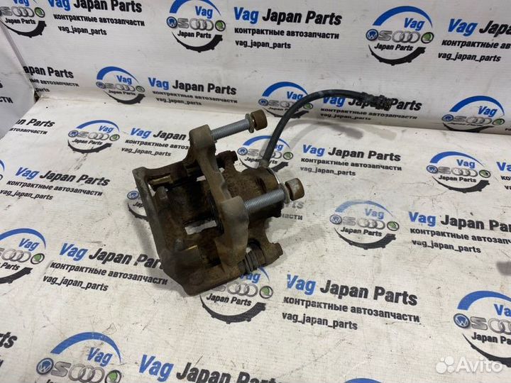 Суппорт тормозной задний левый Volkswagen Tiguan