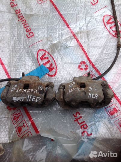 Mitsubishi Lancer 9 суппорт передний