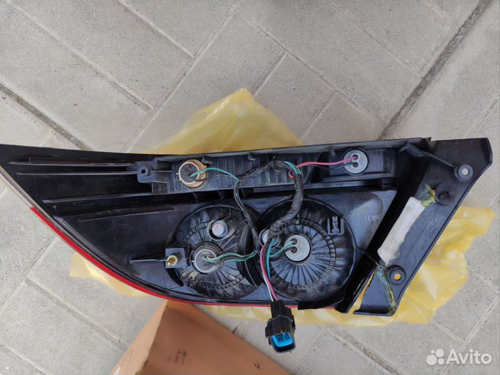 Фонарь задний левый mitsubishi lancer