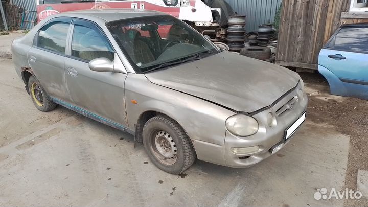 Бампер задний Kia Shuma 1