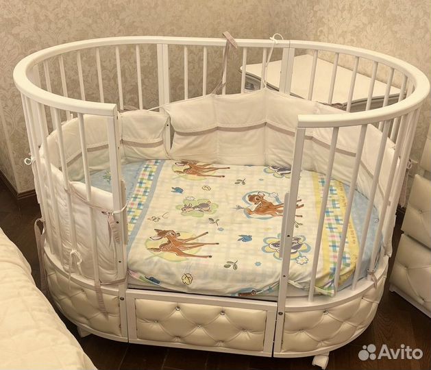 Детская овальная кроватка с маятником