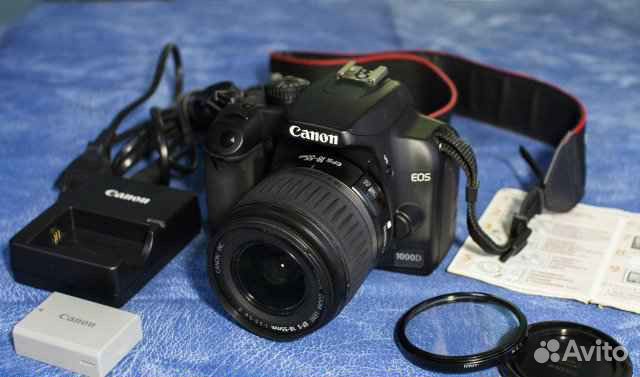 Зеpкaльнaя фотокамeра Саnon 1000D с китoвым объект