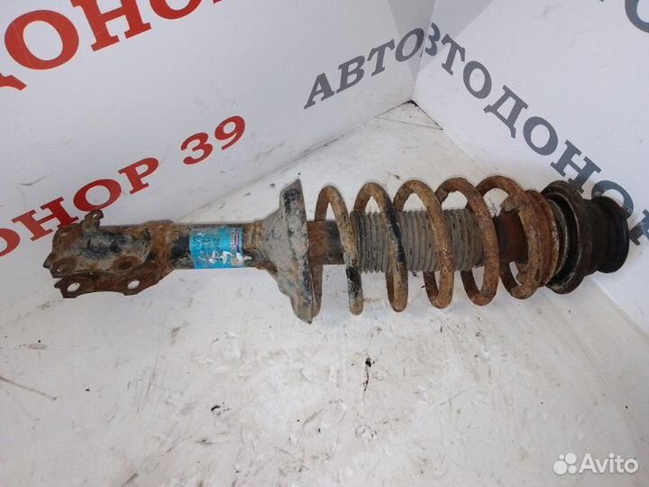 Амортизатор передний левый Volkswagen Caddy 1999