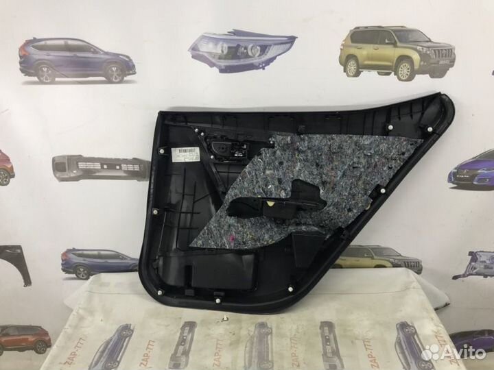 Обшивка двери задняя левая Toyota Corolla E180
