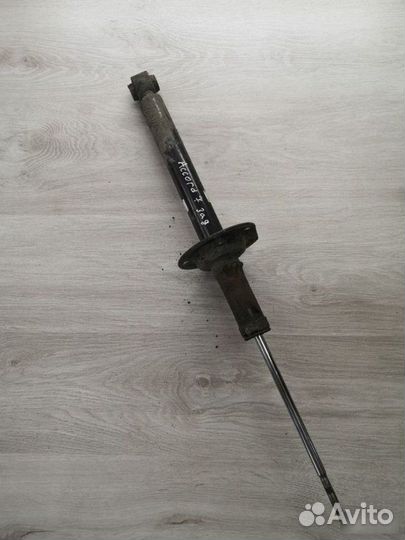 Стойка амортизатора задняя Honda Accord 7