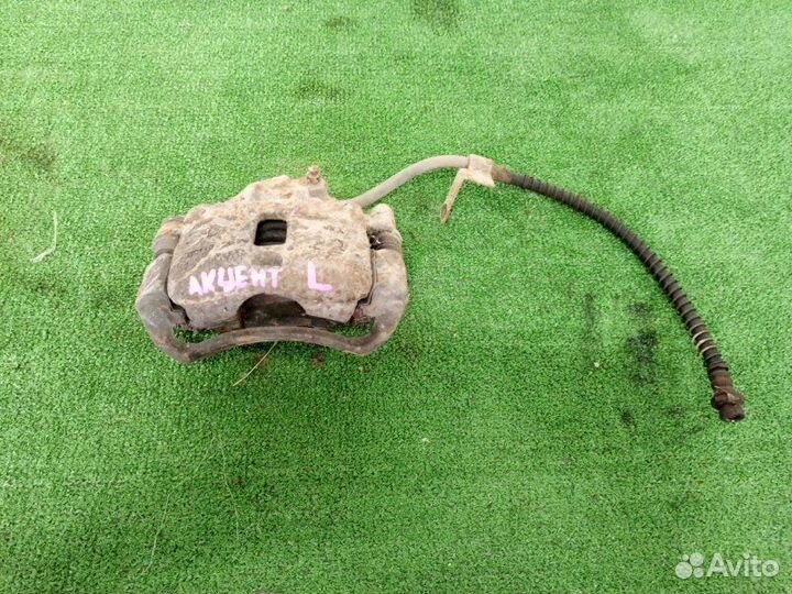 Суппорт тормозной передний левый Hyundai Accent