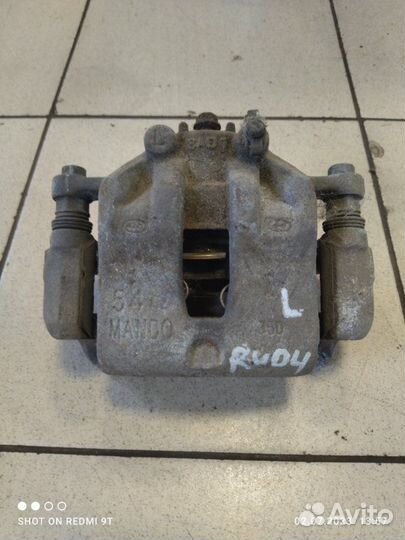 Суппорт тормозной передний левый Kia Rio 4