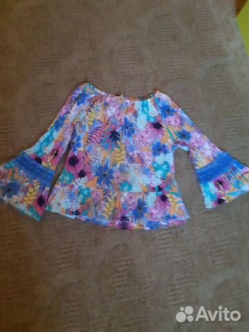 Яркую блузку фирмы cotton kids