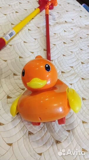 Игрушка каталка с ручкой